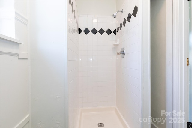 full bath featuring a shower stall