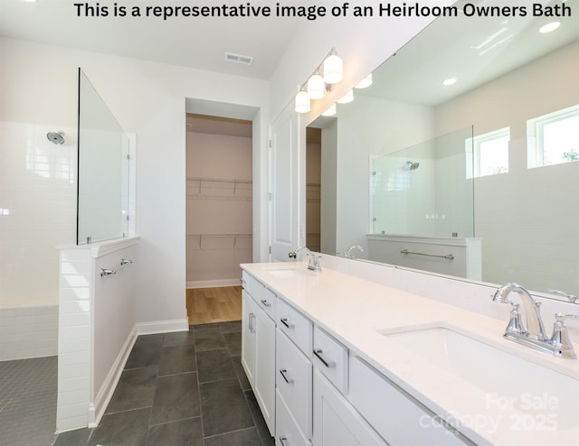1111 Meander Ln, Waxhaw, NC 28173 - full bath with tile patterned floors, a sink, a walk in shower, and visible vents