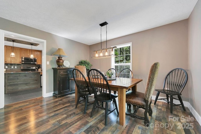 dining room with dark wood-style flooring and baseboards
