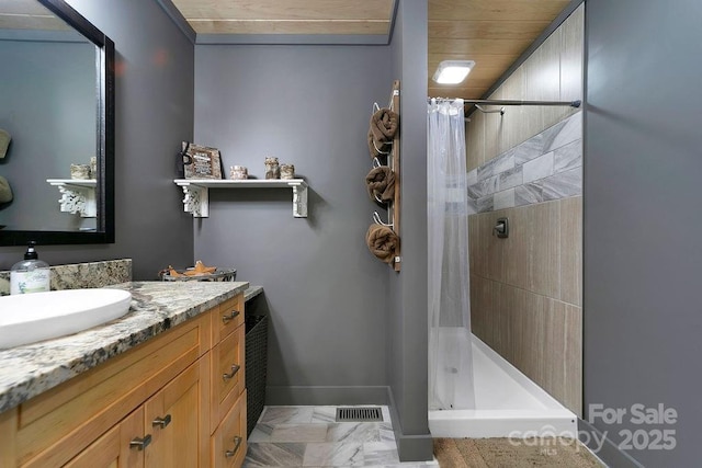 full bathroom featuring a shower stall, visible vents, baseboards, vanity, and marble finish floor