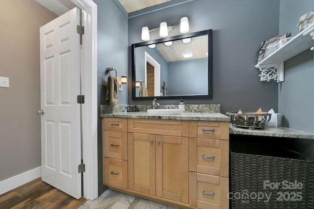 bathroom featuring vanity and baseboards