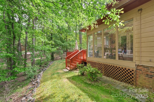 view of yard featuring a sunroom