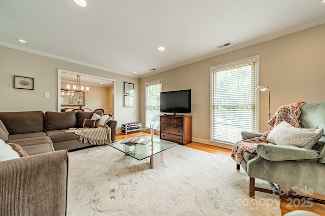 5522 Sharon Rd, Charlotte, NC 28210 - living area featuring a chandelier, crown molding, light wood finished floors, and recessed lighting