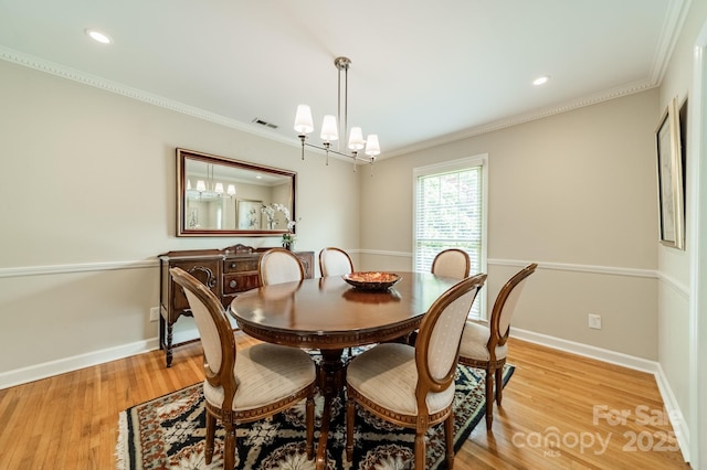 5522 Sharon Rd, Charlotte, NC 28210 - dining area with ornamental molding, light wood finished floors, recessed lighting, and a chandelier