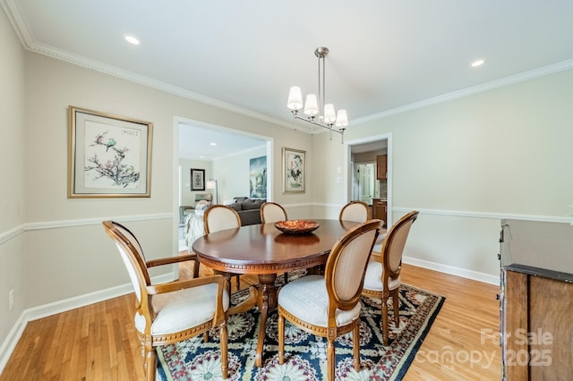 5522 Sharon Rd, Charlotte, NC 28210 - dining space featuring light wood finished floors, ornamental molding, a chandelier, and recessed lighting
