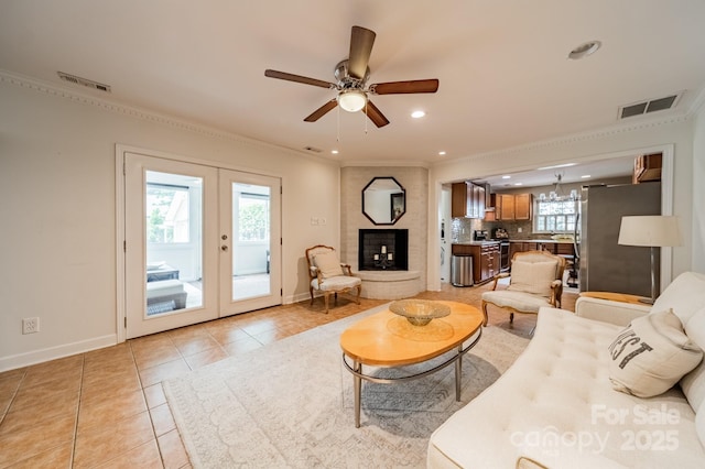 5522 Sharon Rd, Charlotte, NC 28210 - living area with light tile patterned flooring, crown molding, ceiling fan, french doors, and recessed lighting