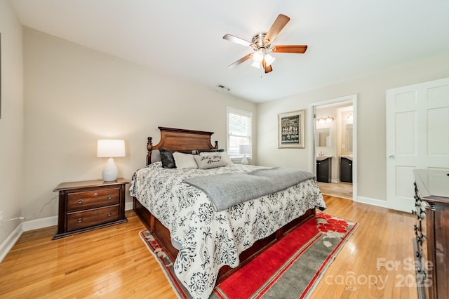 5522 Sharon Rd, Charlotte, NC 28210 - bedroom with light wood-style flooring, ensuite bathroom, and a ceiling fan