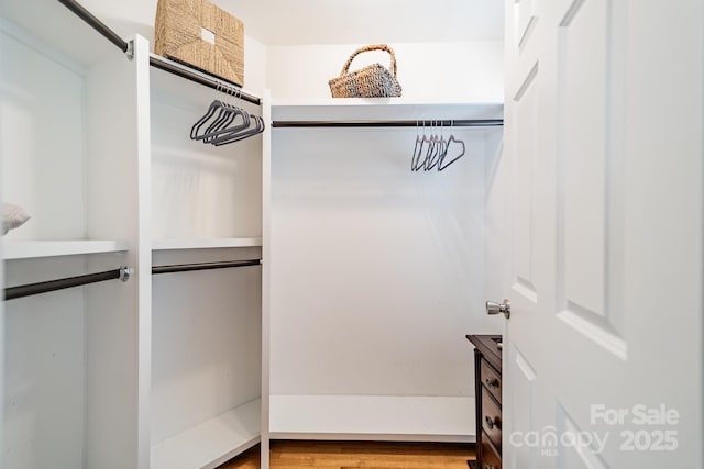 5522 Sharon Rd, Charlotte, NC 28210 - walk in closet featuring wood finished floors