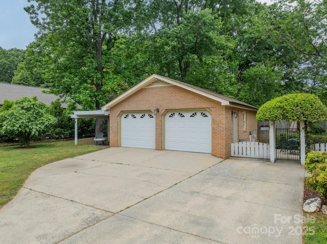 5522 Sharon Rd, Charlotte, NC 28210 - view of front of home featuring brick siding, a garage, and an outbuilding