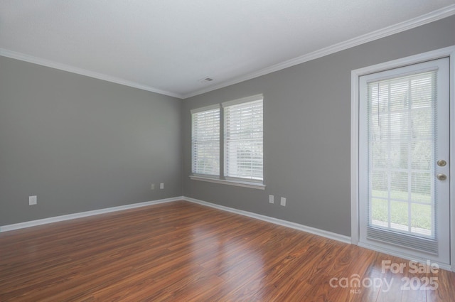 6510 Clavell Ln Unit B, Charlotte, NC 28210 - unfurnished room with dark wood-style floors, baseboards, a healthy amount of sunlight, and crown molding