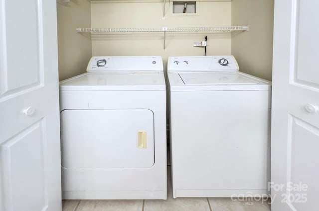 6510 Clavell Ln Unit B, Charlotte, NC 28210 - laundry area featuring washer and clothes dryer, light tile patterned flooring, and laundry area
