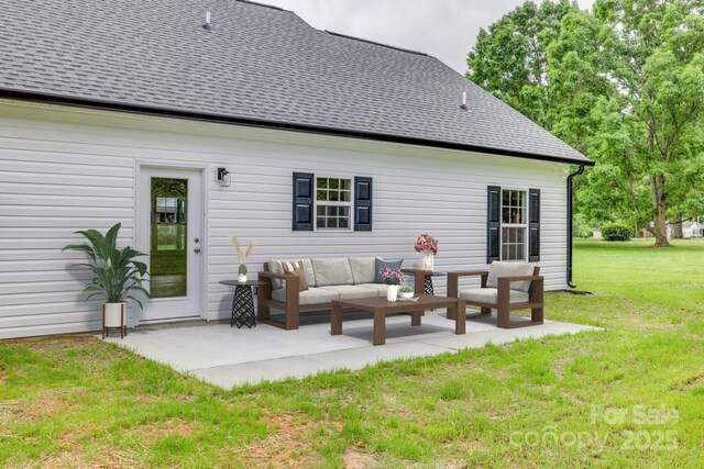 rear view of house featuring a lawn, roof with shingles, an outdoor hangout area, and a patio area