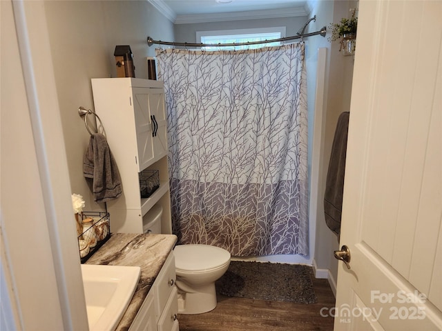 full bathroom with vanity, ornamental molding, wood finished floors, and curtained shower