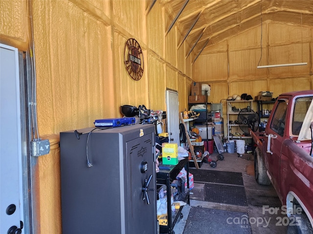 garage featuring wood walls
