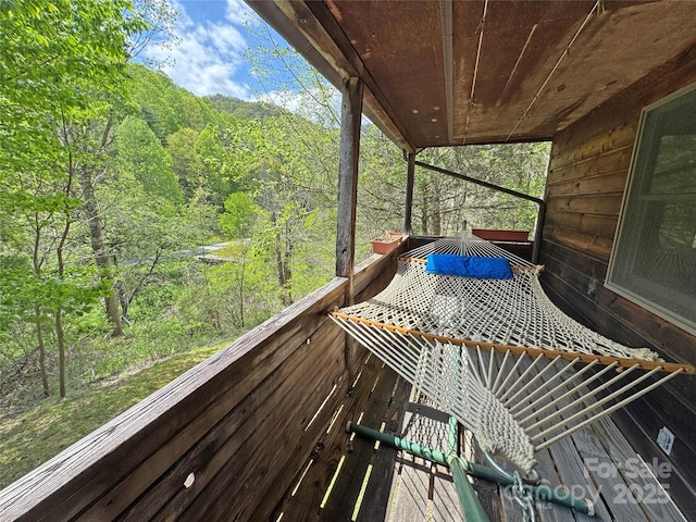 wooden terrace with a forest view
