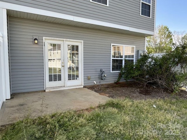 property entrance featuring a patio area