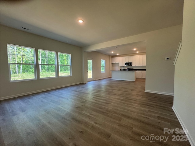 213 Salem Springs Ln, Statesville, NC 28625 - unfurnished living room featuring recessed lighting, dark wood finished floors, visible vents, and baseboards