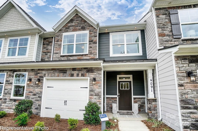 4248 Black Ct Unit 232, Harrisburg, NC 28075 - view of front of house with stone siding and an attached garage