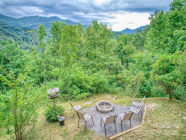 171 Jade Dr, Clyde, NC 28721 - view of yard featuring a fire pit, a forest view, and a mountain view