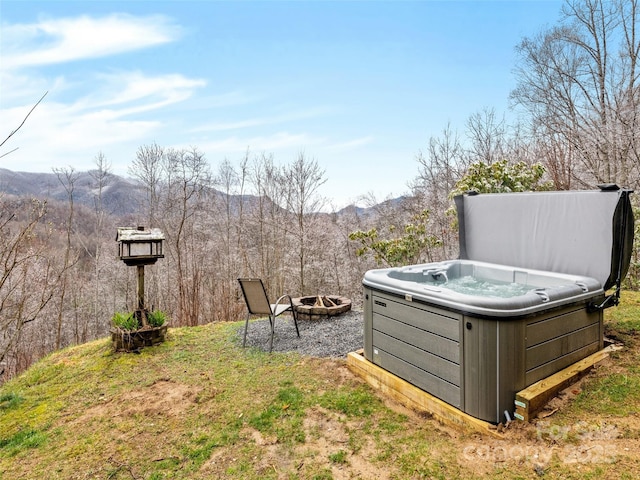 171 Jade Dr, Clyde, NC 28721 - view of yard with an outdoor fire pit, a mountain view, and a hot tub
