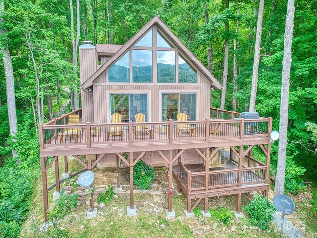 171 Jade Dr, Clyde, NC 28721 - rear view of property with a wooden deck, a chimney, and board and batten siding
