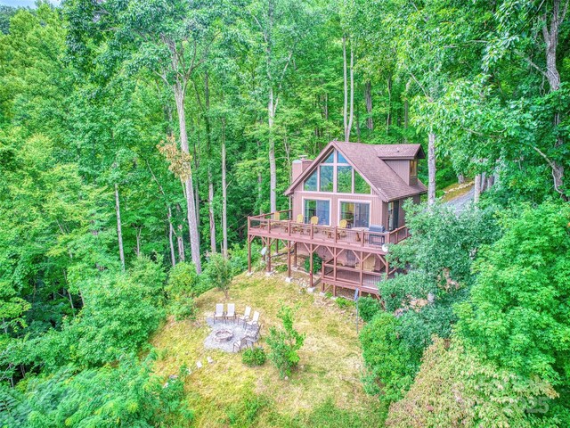 171 Jade Dr, Clyde, NC 28721 - back of property with a deck and a forest view