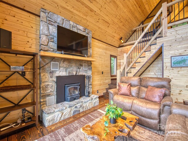 171 Jade Dr, Clyde, NC 28721 - living area with wood walls, stairway, hardwood / wood-style floors, wood ceiling, and high vaulted ceiling