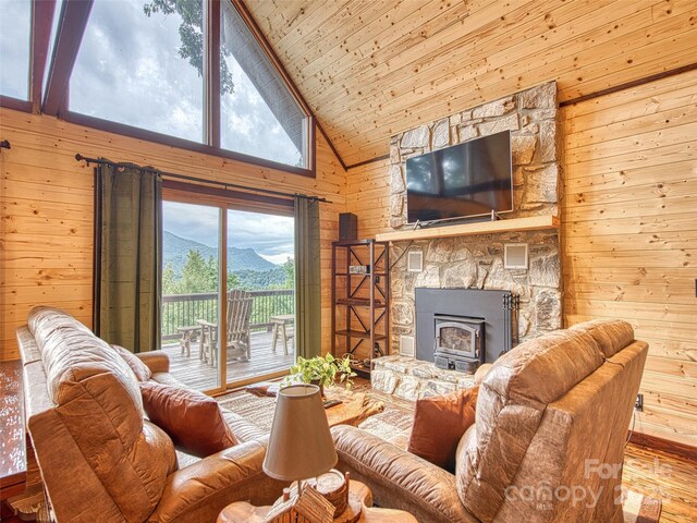 171 Jade Dr, Clyde, NC 28721 - living room featuring wooden walls, wood finished floors, high vaulted ceiling, and wood ceiling