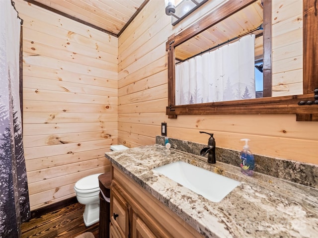 171 Jade Dr, Clyde, NC 28721 - bathroom featuring toilet, vanity, wooden walls, wood finished floors, and wooden ceiling