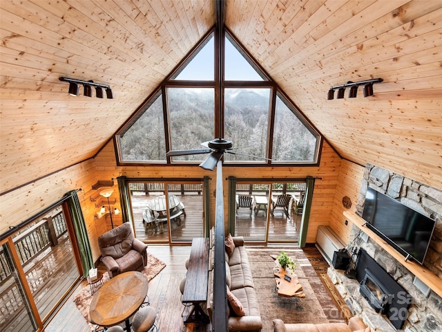 171 Jade Dr, Clyde, NC 28721 - living room with wooden ceiling, wooden walls, plenty of natural light, hardwood / wood-style flooring, and high vaulted ceiling