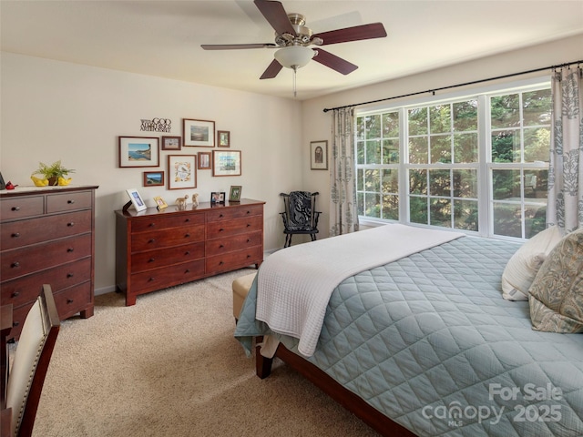 carpeted bedroom featuring ceiling fan