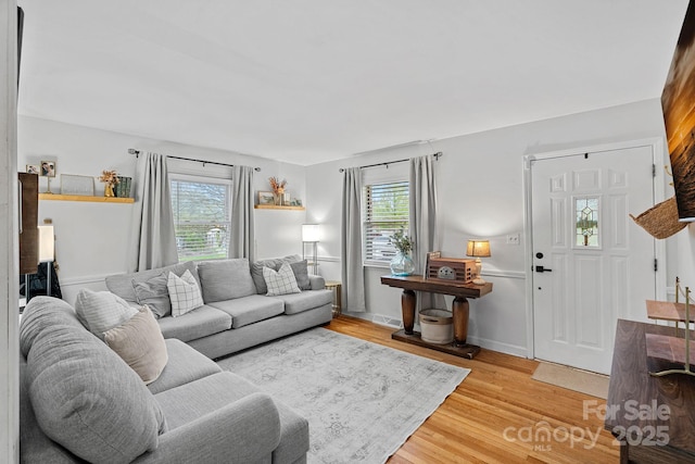 4314 Oak Forest Dr, Charlotte, NC 28215 - living area featuring light wood-style flooring, visible vents, and plenty of natural light