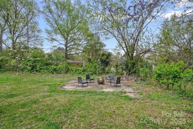 4314 Oak Forest Dr, Charlotte, NC 28215 - view of yard featuring a patio and an outdoor fire pit