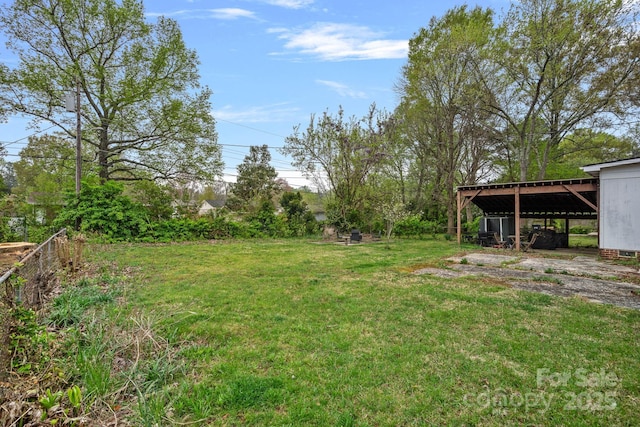4314 Oak Forest Dr, Charlotte, NC 28215 - view of yard with a pole building, an outbuilding, and a carport