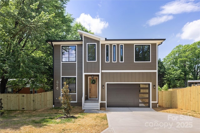 816 Tennyson Dr, Charlotte, NC 28208 - contemporary home with fence, driveway, and a garage
