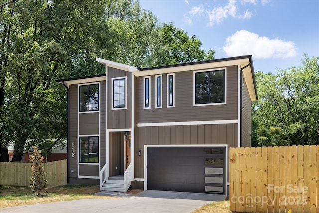 816 Tennyson Dr, Charlotte, NC 28208 - view of front of property featuring fence, an attached garage, and concrete driveway