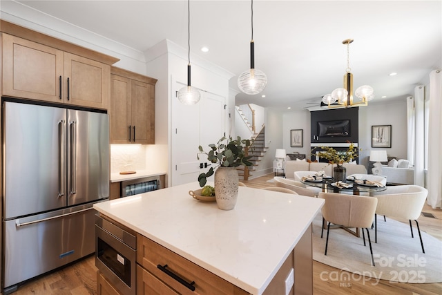 816 Tennyson Dr, Charlotte, NC 28208 - kitchen with recessed lighting, appliances with stainless steel finishes, wood finished floors, and a center island