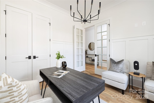 816 Tennyson Dr, Charlotte, NC 28208 - office area with an inviting chandelier, french doors, light wood finished floors, and a decorative wall