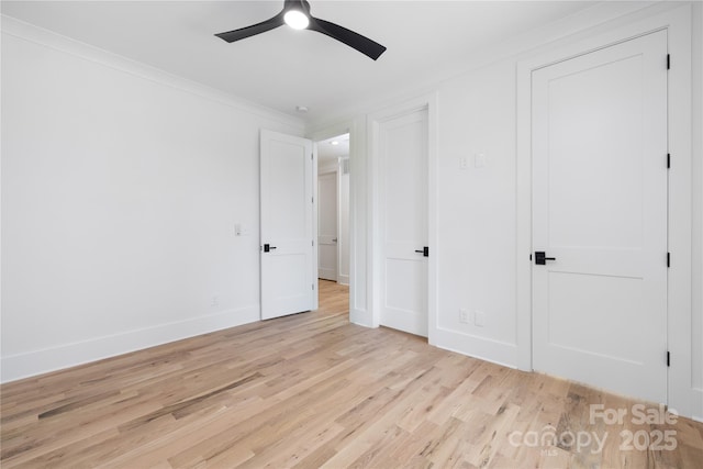 816 Tennyson Dr, Charlotte, NC 28208 - unfurnished bedroom with crown molding, baseboards, a ceiling fan, and light wood finished floors