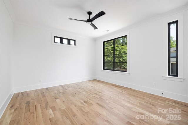 816 Tennyson Dr, Charlotte, NC 28208 - unfurnished room featuring crown molding, baseboards, ceiling fan, and light wood-style flooring
