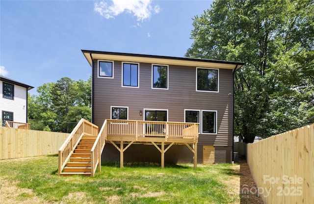 816 Tennyson Dr, Charlotte, NC 28208 - back of house featuring a wooden deck, stairs, a yard, and a fenced backyard