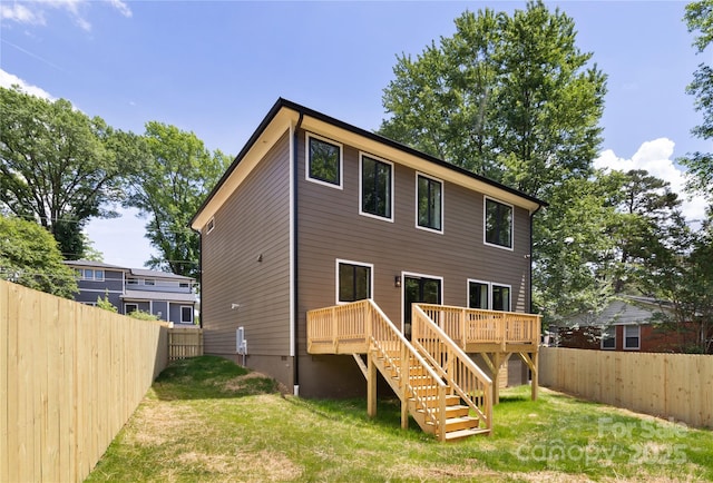 816 Tennyson Dr, Charlotte, NC 28208 - rear view of house featuring a fenced backyard, a wooden deck, a yard, and stairway