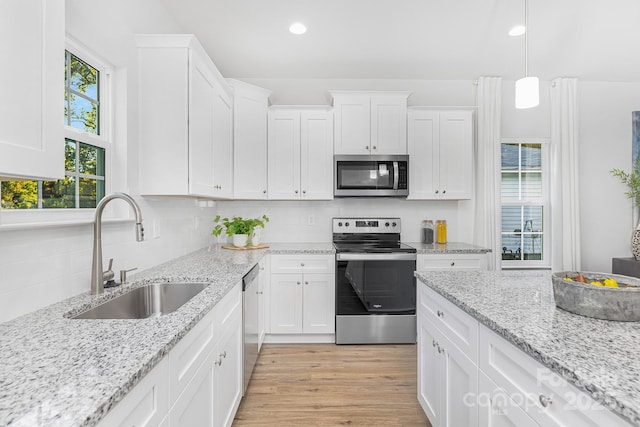 1619 Martin Ave, Gastonia, NC 28052 - kitchen featuring appliances with stainless steel finishes, a sink, white cabinetry, recessed lighting, and decorative backsplash