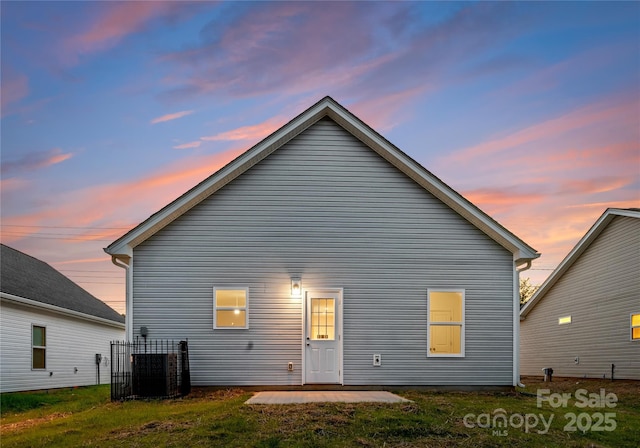 1619 Martin Ave, Gastonia, NC 28052 - back of property at dusk featuring central AC and a patio area