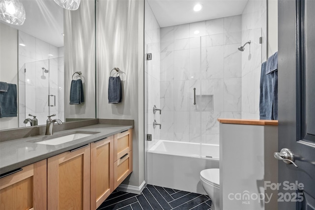 full bath with shower / bath combination with glass door, recessed lighting, vanity, tile patterned floors, and toilet
