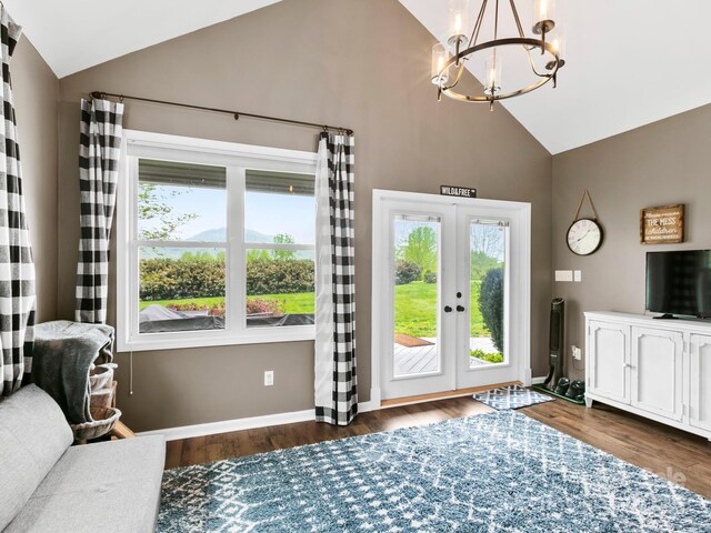 interior space with high vaulted ceiling, a notable chandelier, french doors, and plenty of natural light