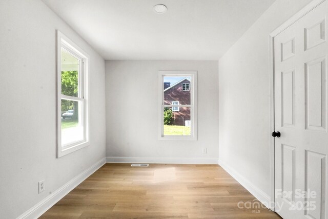 906 Church St, Kings Mountain, NC 28086 - spare room featuring plenty of natural light, light wood-style floors, baseboards, and visible vents