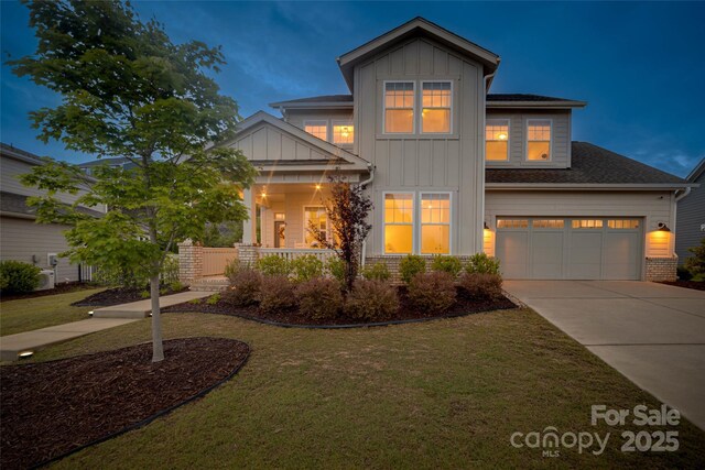 528 Rock Skip Way, Fort Mill, SC 29708 - craftsman house featuring board and batten siding, concrete driveway, and a front yard