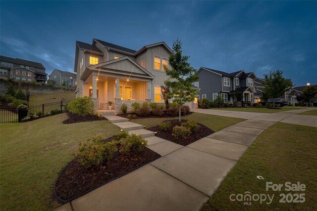 528 Rock Skip Way, Fort Mill, SC 29708 - craftsman-style house featuring board and batten siding, covered porch, concrete driveway, and a residential view