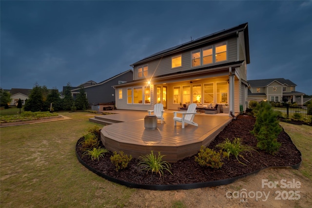 528 Rock Skip Way, Fort Mill, SC 29708 - back of house at night featuring a wooden deck